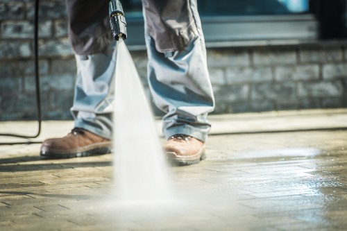 spraying concrete with water