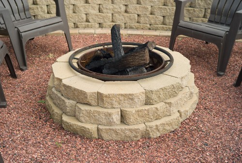 concrete fire pit with chairs